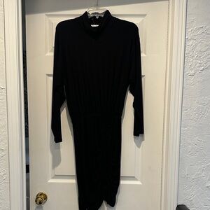 Elegant Black Women's Dress with a high neck. Long sleeve jersey material.